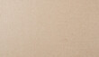 © Arthur - Close-Up of Natural Beige Textured Paperboard with Fine Lines and Subtle Imperfections, Neutral Rustic Backdrop for Creative Design Eco-Friendly Packaging Concepts. Banner Poster Background Wallpaper