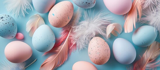 Poster - Easter theme Light background featuring pastel colored eggs and feathers with space for text Top view flat lay. with copy space image. Place for adding text or design