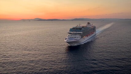 Wall Mural - aerial view of a generic cruise ship traveling over the ocean during golden summer sunset time
