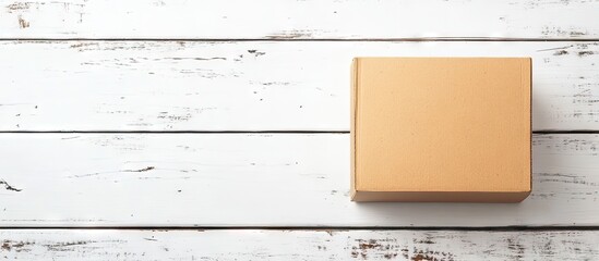 Leinwandbilder - Cardboard box on a white rustic wooden surface with copy space