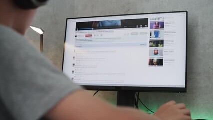 Poster - pc monitor showing video sharing platform with video content about filmmaking. caucasian teenage boy