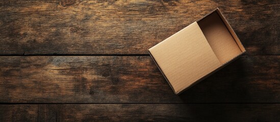 Poster - Mockup of an empty brown trapezoidal cardboard box on an old wooden table seen up close Top view flat lay and space for text Banner. with copy space image. Place for adding text or design
