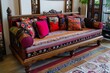 © ylivdesign - Traditional indian style interior with wooden sofa covered with colorful pillows and carpets