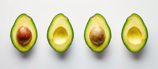 Poster - Flat lay arrangement featuring ripe avocados against a white background with space for text Top view. with copy space image. Place for adding text or design
