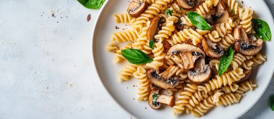 Poster - Gluten free fusilli pasta with forest mushrooms on a white plate Vegetarian vegan dish Italian cuisine Top view flat lay copyspace
