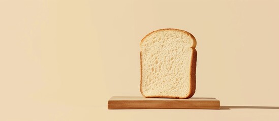 Poster - Minimalist concept featuring a white bread slice on a wooden board set against a beige background ideal for vegan product promotions with copy space image