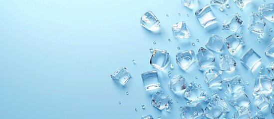 Poster - Flat lay with crystal clear ice cubes on a light blue background providing ample copy space for the image