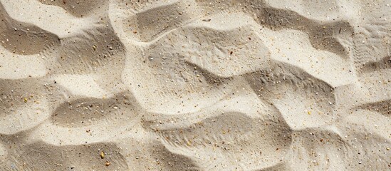 Wall Mural - Top view of beach sand offering a clear clean and smooth natural texture perfect for summer themed concepts travel vacations and outdoor enjoyment ideal for copy space image