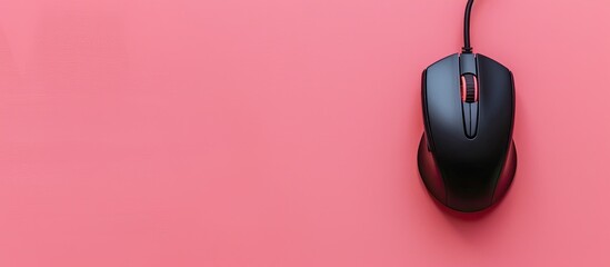 Poster - top view of a wired mouse and mousepad placed on a pink background with space available for text in 