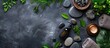 © StockKing - Top view composition featuring spa stones, greenery, cosmetics, and ample copy space image.