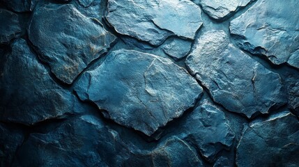 A blue stone wall with a rough texture