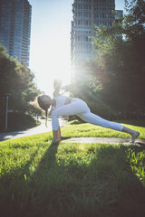 Beautiful girl making morning yoga training in New york