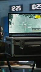Poster - Vertical video Military soldier wearing camo uniform in mission control center, overseeing national safety operations using laptop. Army expert examining data in monitoring room command center, camera