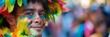 © nopommajun - A person adorned with glittering, colorful face paint smiles vibrantly at the camera during a lively parade, celebrating vibrant culture.