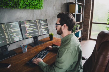 Wall Mural - Photo of successful handsome man developer expert wear shirt work with modern technology operating system server pc indoors