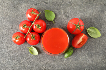 Sticker - Tasty tomato juice in glass, basil and fresh vegetables on grey table, flat lay