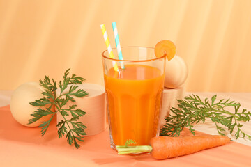 Sticker - Fresh carrot juice in glass and vegetable on coral background