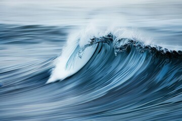 Wall Mural - A large wave forming in the middle of the ocean, showcasing the raw power of nature, Peaceful waves of powder blue ebbing and flowing