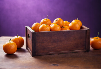 Wall Mural - Fresh tangerines in wooden box on rustic table.