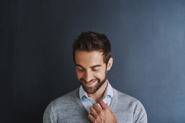 Poster - Smile, thinking and business man in studio for idea, vision and fashion isolated on background. Happy employee, planning future and professional insight for decision, mindset and dream of opportunity