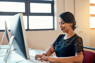 Poster - Administration, computer and typing with designer woman at desk in office for online project report. Email, feedback and research with confident employee in agency or creative workplace for job