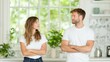 © Sunny_nsk - A young couple in white t-shirts stand facing each other with confused expressions and slightly raised eyebrows. Both are standing straight with their arms crossed.