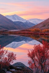 Wall Mural - Stunning autumn landscape with misty mountains reflected in a lake, under the warm glow of a sunset.