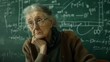 © VK Studio - An elderly woman, deep in thought, sits in front of a chalkboard filled with complex equations, capturing a moment of wisdom and contemplation.