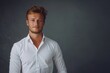 © Maryna - White Dress Shirt. Handsome Young Man Posing in Elegant Business Attire with Confidence
