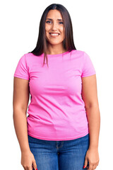 Sticker - Young beautiful brunette woman wearing casual t-shirt looking positive and happy standing and smiling with a confident smile showing teeth