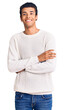 © Krakenimages.com - Young african amercian man wearing casual clothes happy face smiling with crossed arms looking at the camera. positive person.