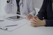 © rogerphoto - Doctor and a patient in clinic. The female physician is using tablet computer for filling up medication history record form, close up of woman hands. Medicine and science