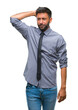 © Krakenimages.com - Adult hispanic business man over isolated background confuse and wonder about question. Uncertain with doubt, thinking with hand on head. Pensive concept.