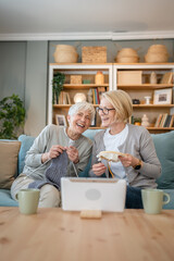 Wall Mural - two women senior mature knitting and embroidery during leisure time