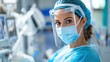 © Lens Legacy - A medical professional wearing protective gear, including a face shield, hairnet, and surgical mask, is focused on their work in a hospital setting filled with medical equipment.