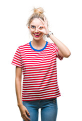 Sticker - Young beautiful blonde woman wearing glasses over isolated background doing ok gesture with hand smiling, eye looking through fingers with happy face.