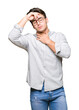 © Krakenimages.com - Young handsome man wearing glasses over isolated background Touching forehead for illness and fever, flu and cold, virus sick