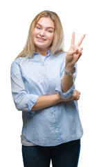 Poster - Young caucasian business woman over isolated background smiling with happy face winking at the camera doing victory sign. Number two.