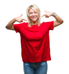 Sticker - Young beautiful blonde woman wearing red t-shirt over isolated background smiling confident showing and pointing with fingers teeth and mouth. Health concept.