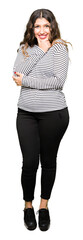 Sticker - Young beautiful woman wearing stripes sweater looking confident at the camera with smile with crossed arms and hand raised on chin. Thinking positive.