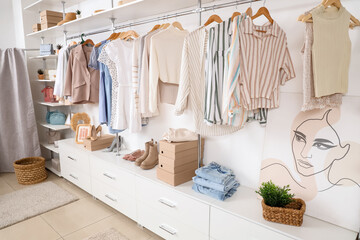 Poster - Interior of stylish boutique with clothes and shoes