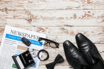 Wall Mural - Male shoes with newspaper and accessories on white wooden background