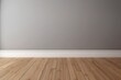 © YOUR - Grey Wall with White Baseboard and Wooden Floor
