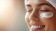 © Mnt - A serene woman enjoying skincare treatment with cream on her face, promoting relaxation and beauty care.