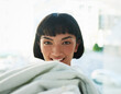 © StarDweller/peopleimages.com - Laundry, portrait and smile with woman in home for chores, cleaning or housework on weekend. Fabric, face and responsibility with happy person in apartment for housekeeping, hygiene or washing