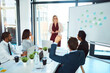 © SensSai/peopleimages.com - Business people, hand up or asking in presentation for profit growth, group discussion or meeting. Psychology, staff team or woman speaking of training question, teaching or revenue increase advice