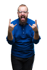 Sticker - Young caucasian hipster man wearing glasses over isolated background shouting with crazy expression doing rock symbol with hands up. Music star. Heavy concept.