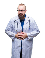 Young caucasian doctor man wearing medical white coat over isolated background with hand on stomach because indigestion, painful illness feeling unwell. Ache concept.