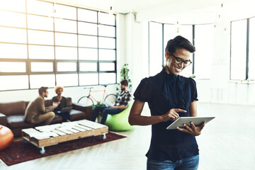 Fototapete - Creative, woman and smile with tablet in office for business, research and reading online news. Happy, worker and designer with digital technology for communication, project plan and email to client