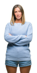 Poster - Young beautiful woman wearing winter sweater over isolated background skeptic and nervous, disapproving expression on face with crossed arms. Negative person.